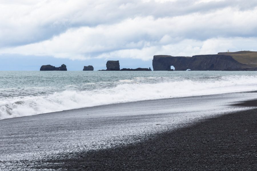 travel to Iceland - Reynisfjara black sand beach and Dyrholaey cape in Iceland, near Vik I Myrdal village on Atlantic South Coast in Katla Geopark in september