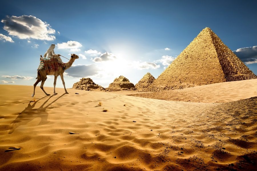 Bedouin-on-camel-near-pyramids-in-desert_edited