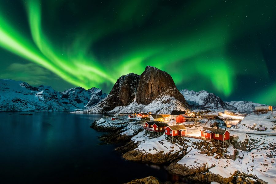 Tours to Norway from Australia. Aurora borealis over Hamnoy in Norway