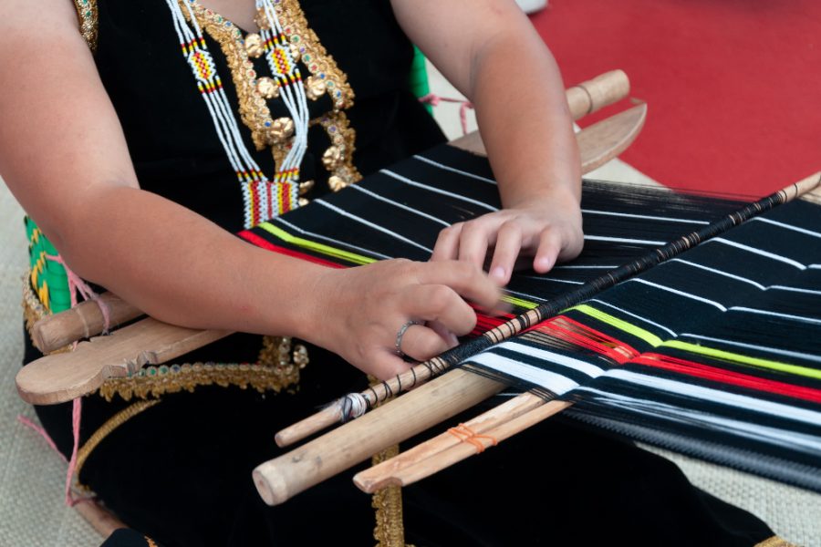 Hand weaving a traditional clothes Sabah Borneo Malaysia_edited