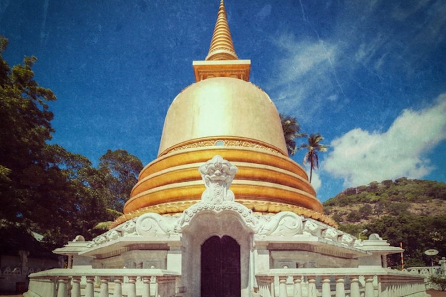 Vintage retro hipster style travel image of buddhist dagoba (stupa) close up with grunge texture overlaidin Golden Temple, Dambulla, Sri Lanka