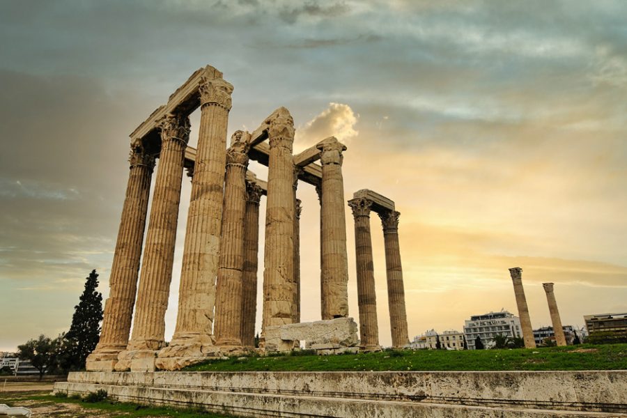 Panorama of Temple of Olympian Zeus, Athens, Greece. It is a great landmark of Athens. Huge Ancient Greek ruins overlooking Acropolis of Athens. People visit the remains of the antique Athens city.